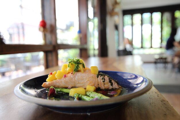 Baked salmon fillet with rosemary, lemon and mango