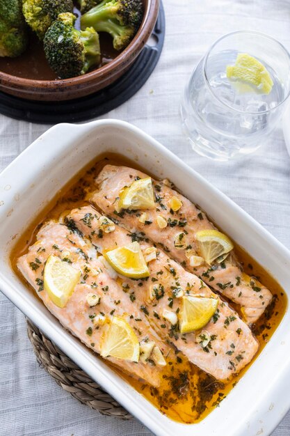Baked salmon loins with olive oil, honey and garlic. Mediterranean and healthy cuisine