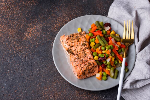 Baked salmon with boiled vegetable