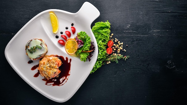 Baked salmon with grilled vegetables Top view Free space for text On a wooden background