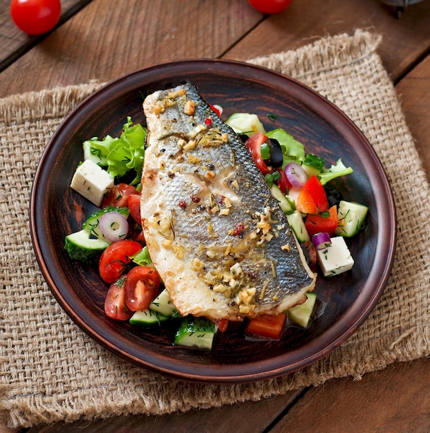 Baked seabass with Greek salad