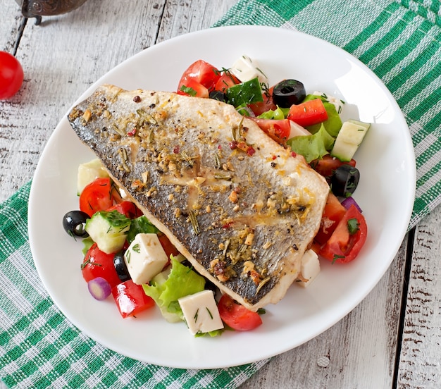 Baked seabass with Greek salad