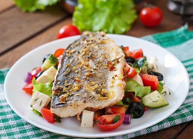 Baked seabass with Greek salad