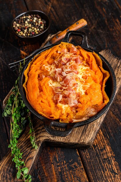 Baked in skin sweet potato batata stuffed with cheese and bacon.