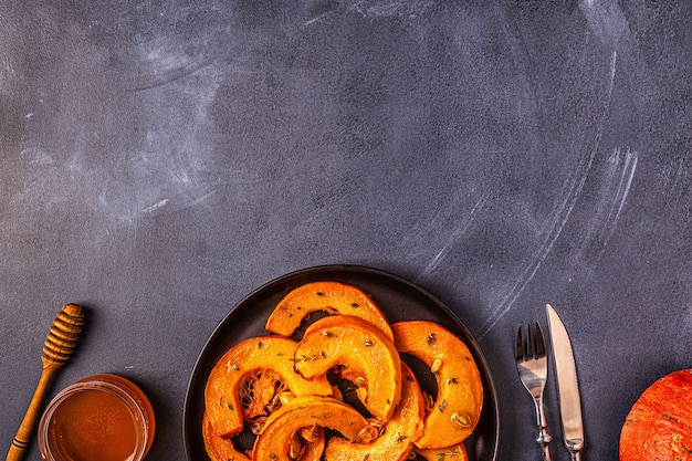 Baked slices of pumpkin with spices