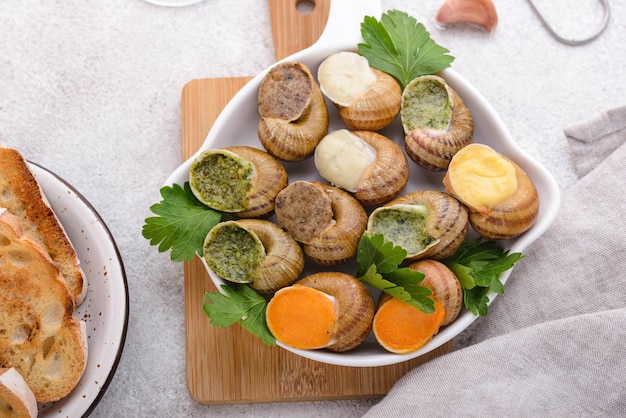 Baked snails escargot with bread