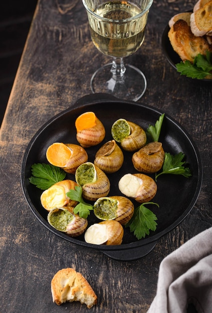 Baked snails escargot with bread