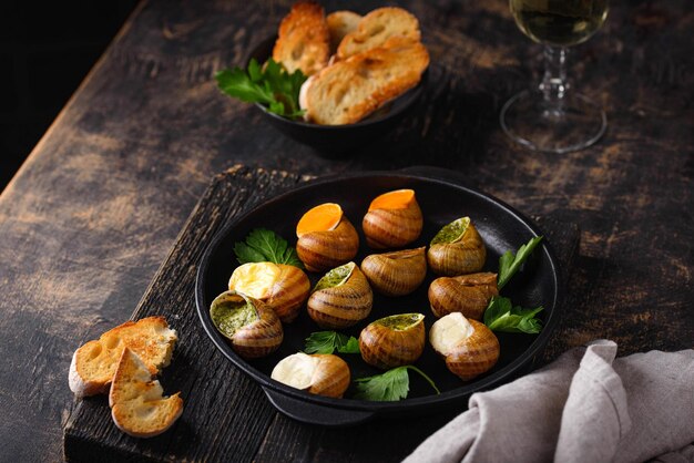 Baked snails escargot with bread