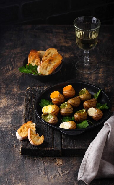 Baked snails escargot with bread