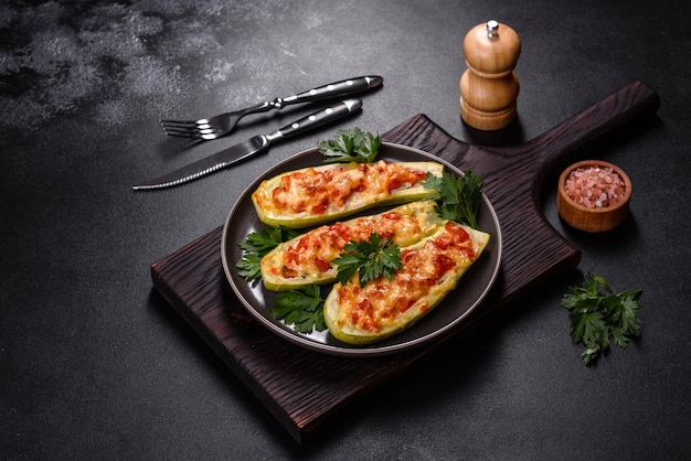 Baked stuffed zucchini boats with minced chicken mushrooms and vegetables with cheese