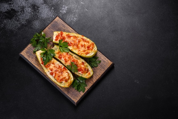 Baked stuffed zucchini boats with minced chicken mushrooms and vegetables with cheese