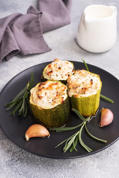 Baked stuffed zucchini with minced chicken and vegetables