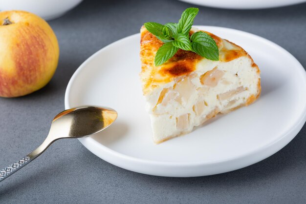 Baked Sweet Cottage Cheese casserole with apple decorated mint