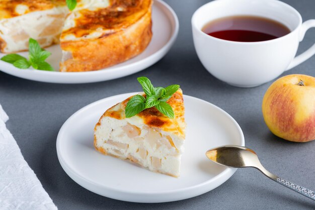 Baked Sweet Cottage Cheese casserole with apple decorated mint