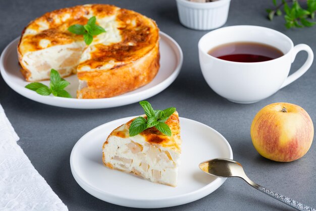 Baked Sweet Cottage Cheese casserole with apple decorated mint