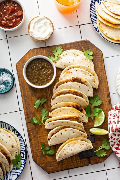 Baked tacos with Mexican Shredded Beef and cheese