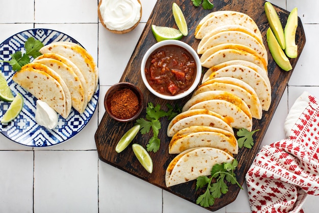 Baked tacos with pulled chicken and cheese