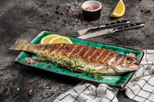 Baked trout fish Grilled trout barbeque with lemon Healthy eating concept banner menu recipe place for text top view