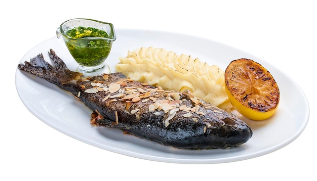 Baked trout with almonds and mashed potatoes On white background