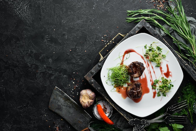 Baked veal in cranberry sauce Veal medallions Top view Free space for your text