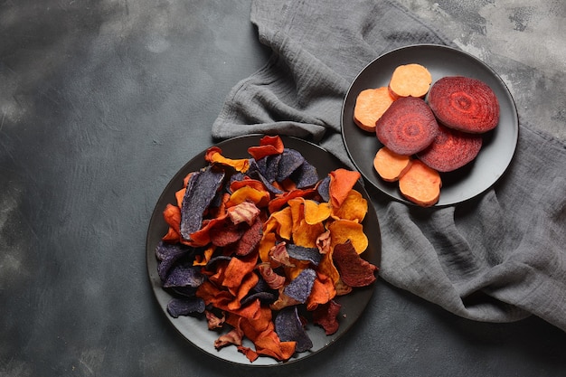 Baked vegetable chips- purple garnet sweet potato, carrot and beetroot.