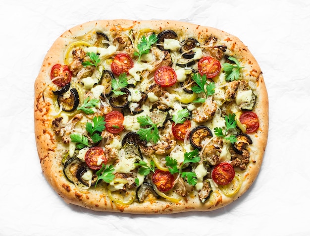 Baked vegetables vegetarian flatbread on a light\
background