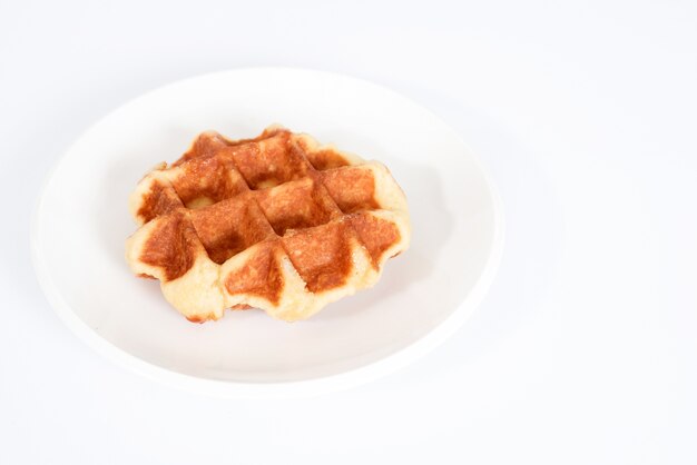 Baked waffles on white background