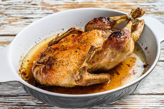 Baked whole farm duck in a baking dish