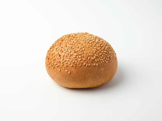 Baked whole round bun with sesame seeds made from white wheat flour