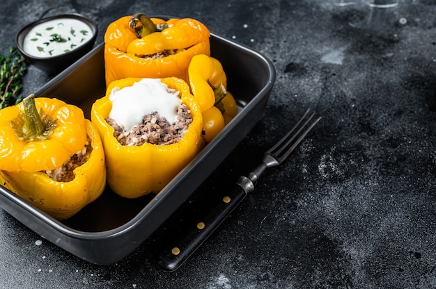 Baked yellow Sweet bell pepper stuffed with beef meat, rice and vegetables