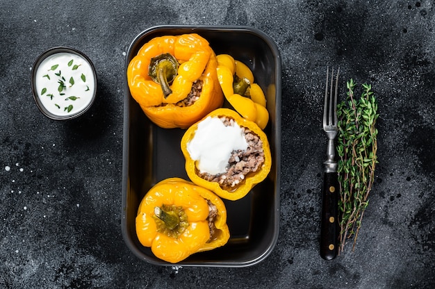 Baked yellow Sweet bell pepper stuffed with beef meat, rice and vegetables