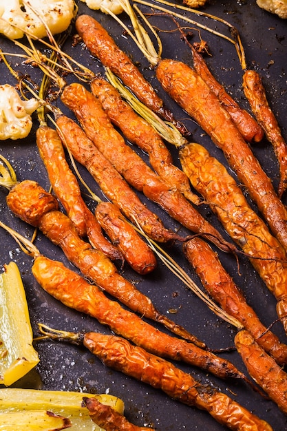 Baked young carrots on the frying pan