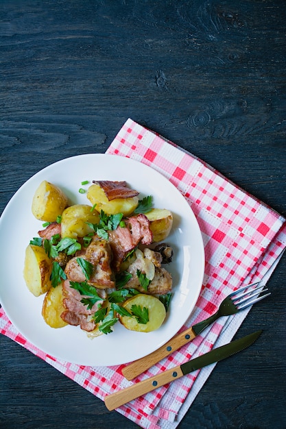 Baked young potatoes with meat and vegetables. 