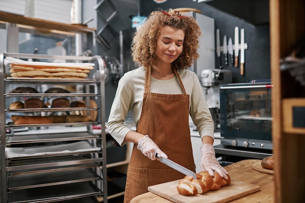 Baker Cutting Bread