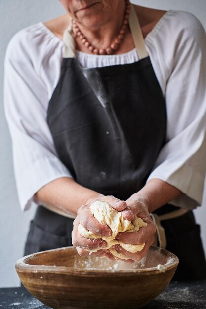 Baker hands kneading dough