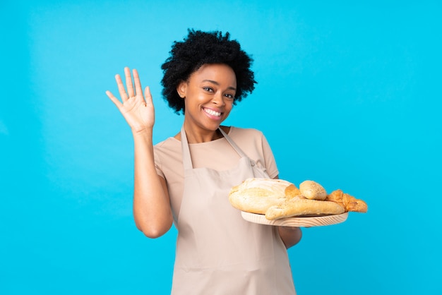 Baker woman over blue wall