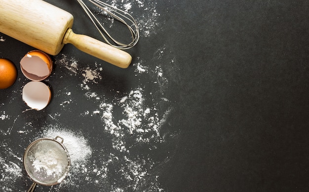 Bakery on black granite table in top view flat lay with copy space for background