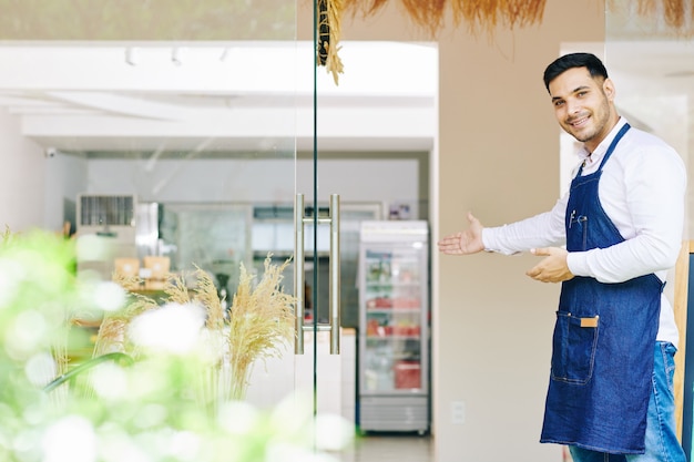 Bakery owner welcoming customers