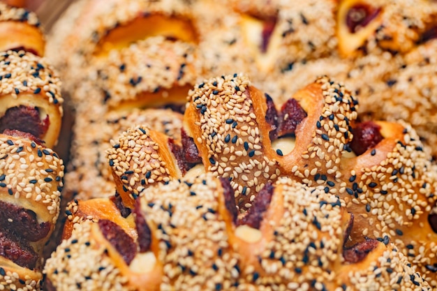 Bakery products baked goods with light and black sesame seeds selective focus