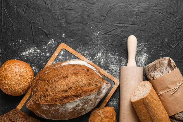 Bakery products composition on black space, top view and space for text