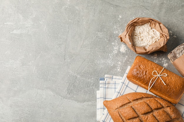 Bakery products composition on grey space, top view and space for text