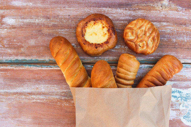  Bakery products in paper bag on table in top view