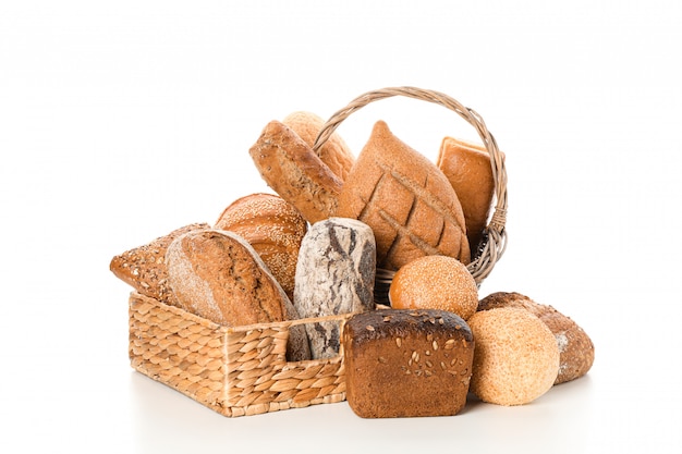 Bakery products in straw basket isolated 