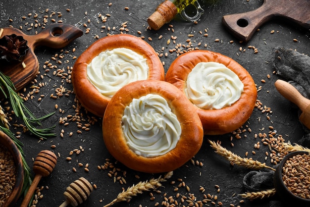 Bakery sweet buns with cottage cheese Baking from rye and flour Top view Rustic style