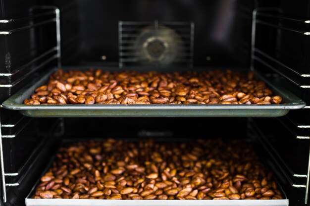 Baking almonds in an industrial oven