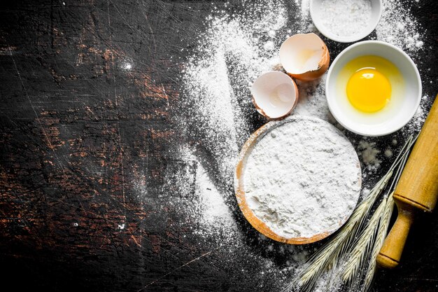 Baking background Flour with spikeles and a rolling pin