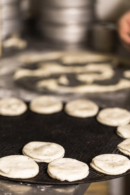 Baking bread for Italian meatball sliders in Italian restaurant.