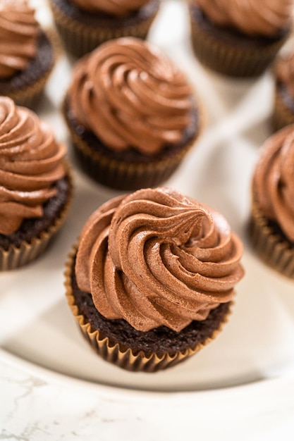 Baking chocolate cupcakes with decadent chocolate frosting