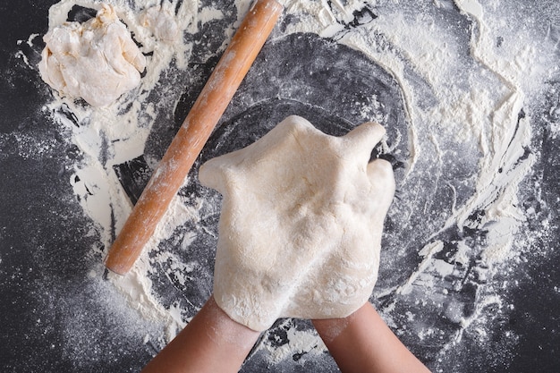 Baking concept. Handmade thin dough. Cooking hands