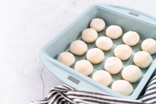 Baking dinner rolls from the premade frozen dough in the baking pan.